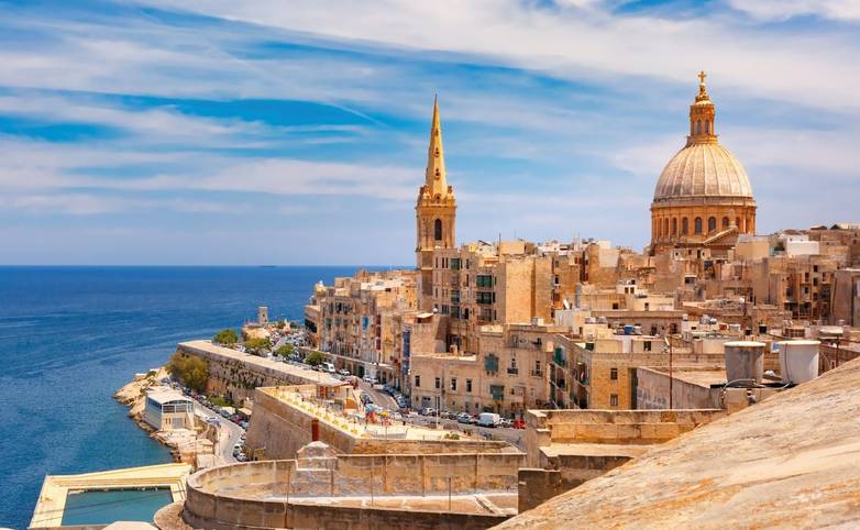 View from above of roofs and church of Our Lady of Mount Carmel and St. Paul's Anglican Pro-Cathedral, Valletta, Capital cit…