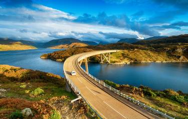 The Kylesku Bridge spanning Loch a' ChÃ irn BhÃ in in the Scottish Highlands and a landmark on the North Coast 500 tourist d…