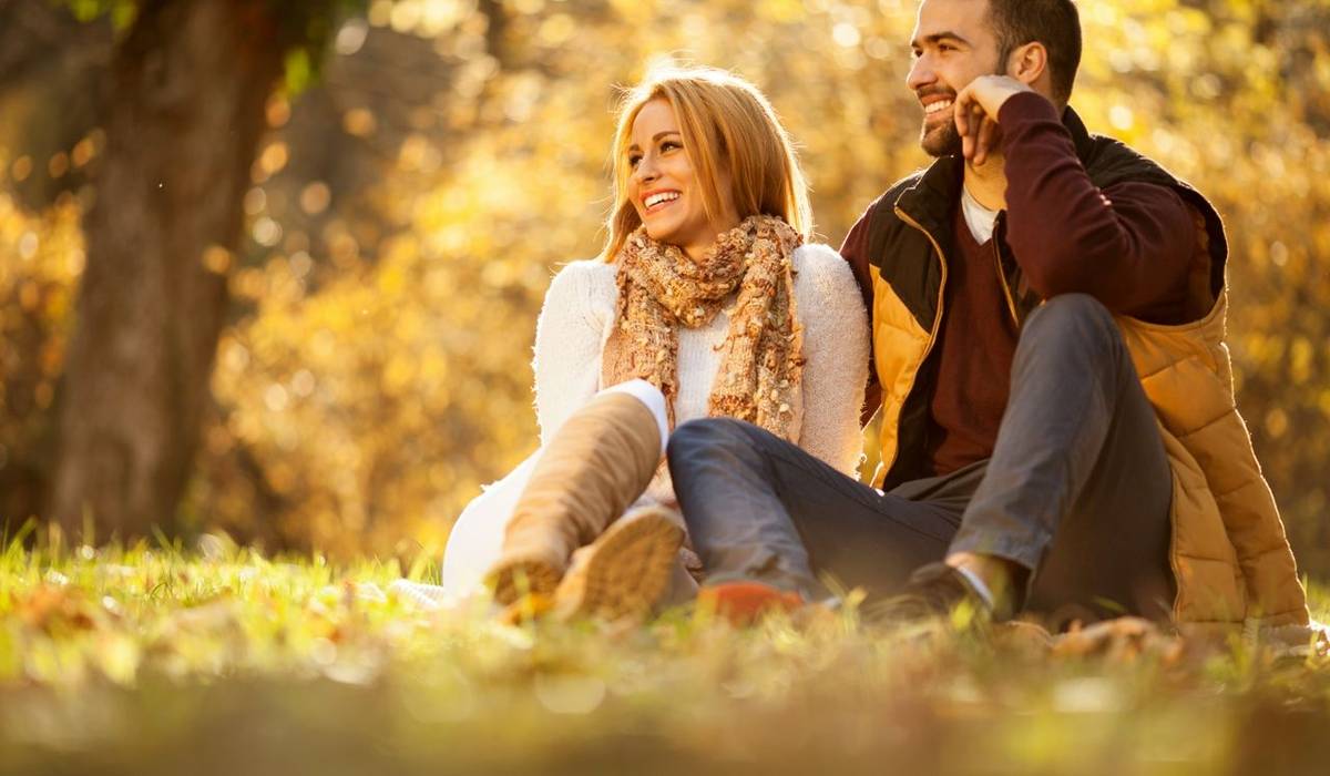 Beautiful couple in love in colorful park