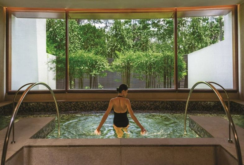 Capella Singapore woman in hydrotherapy pool.jpg