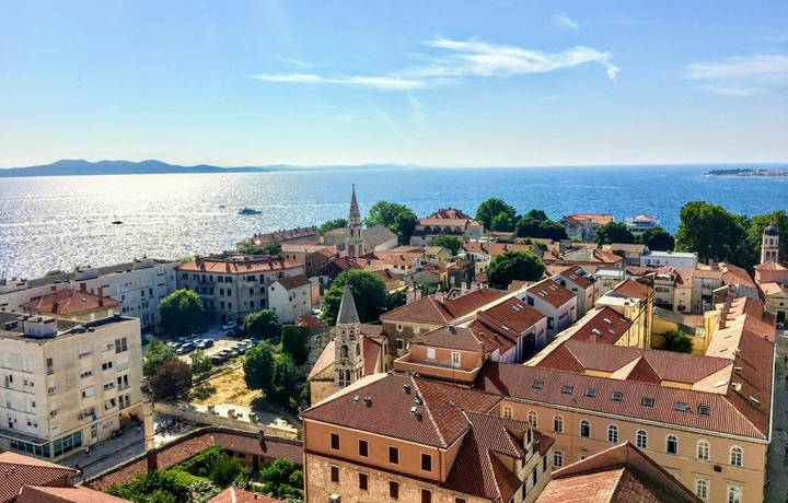 A beautiful view looking down on the old town of Zadar, Croatia from the famous Bell Tower, with the beautiful Adriatic Sea … A beautiful view looking down on the old town of Zadar, Croatia from the famous Bell Tower, with the beautiful Adriatic Sea …
