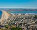 PortlandDorsetEnglandJuly 24, 2018View from Portland Heights overlooking the town of Fortune's Well, showing Chesil Beac…