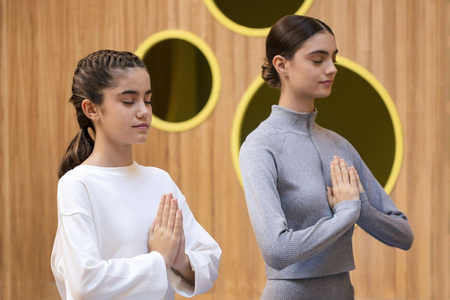 Sisters meditating at Zulal Wellness Resort