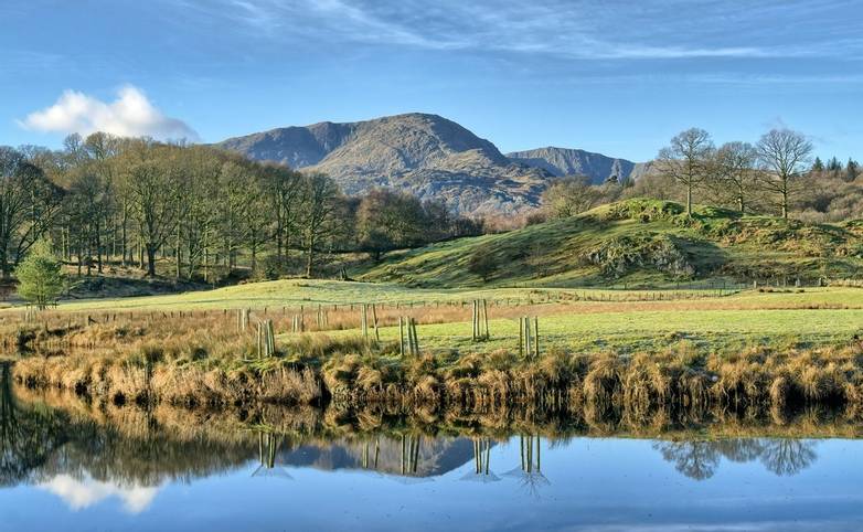 A view of Wetherlam, a mountain in the English lake District across Elterwater. Great Langdale, the English Lake District.