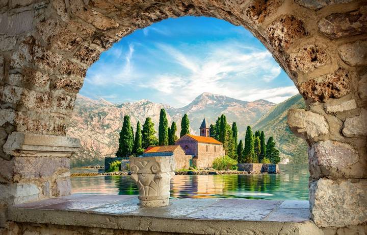 View on St George island from Our Lady of the Rocks through arch. Perast, Montenegro