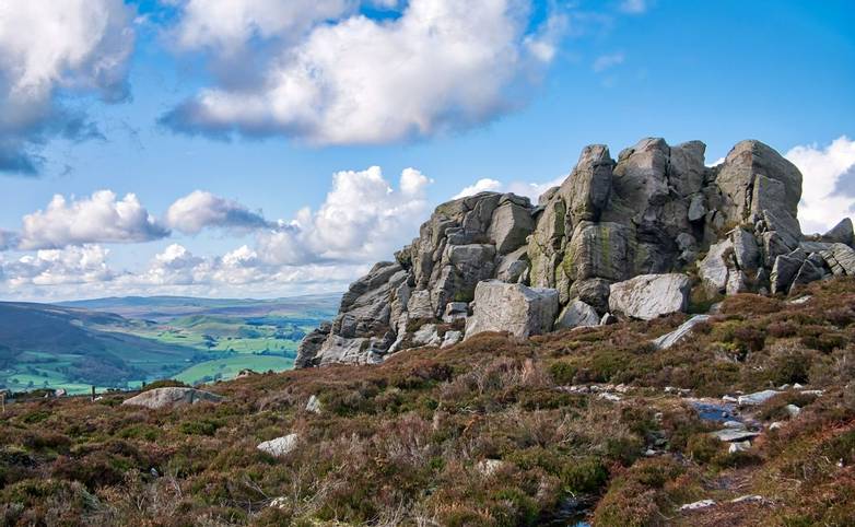 A rocky, millstone outcrop near Simon's Seat on Barden Fell in the Yorkshire Dales, England, UK - taken on a sunny day in Au…