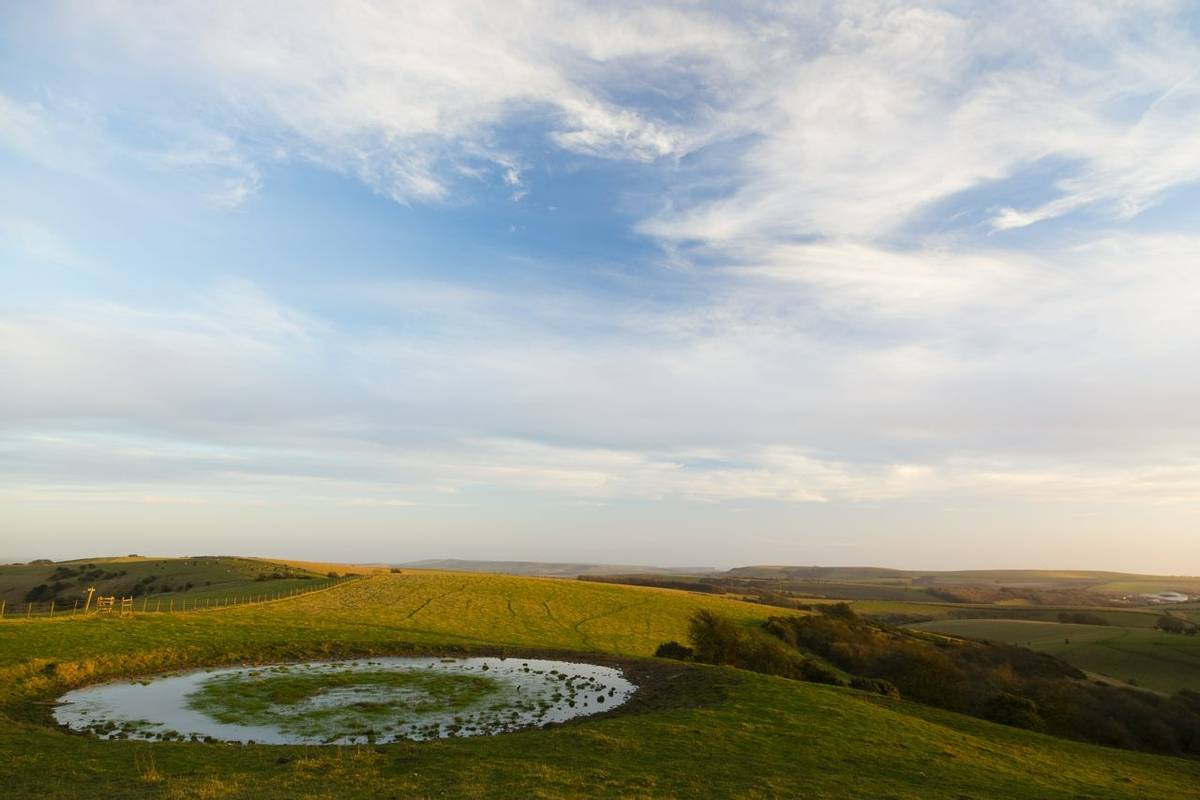 Ditchling Beacon, Sussex, UK. Small circular pond at Ditchling Beacon.