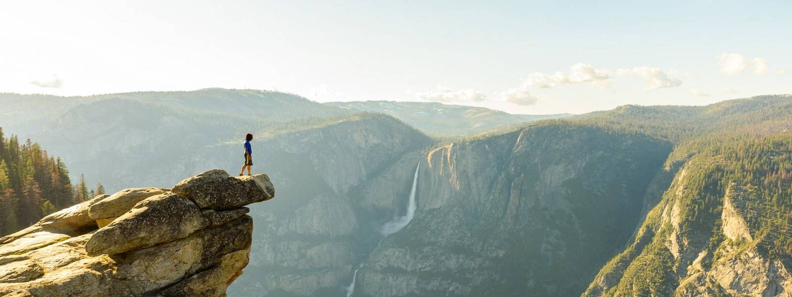 Hiker at the Glacier Point with View to Yosemite Falls and Valley in the Yosemite National Park, California, USA