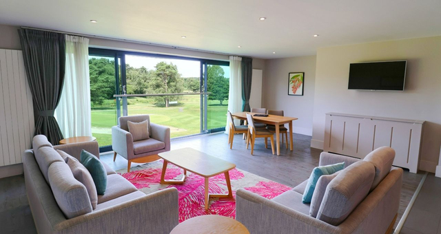 Cheersing drink of Prosecco in hotel swimming pool