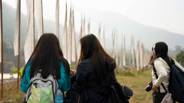 Women and prayer flags, Bhutan