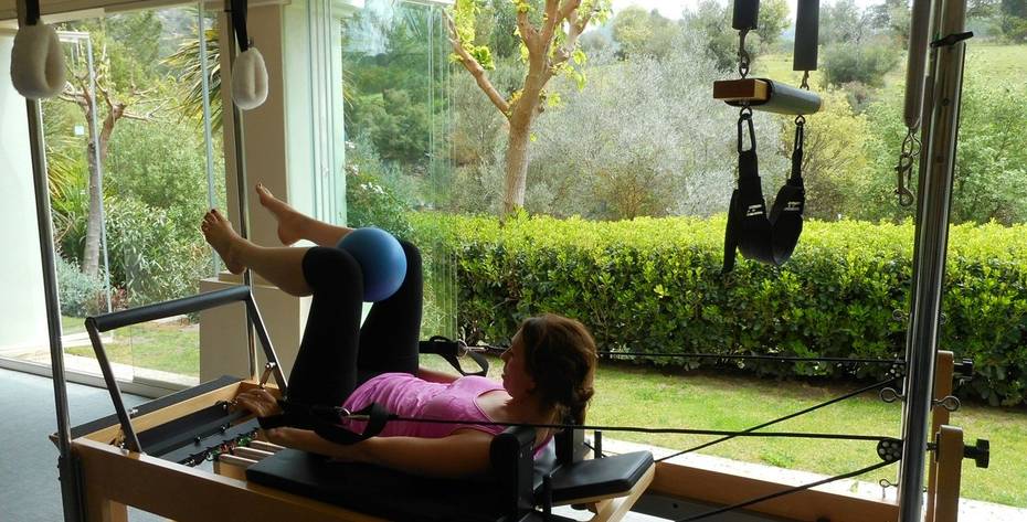 A woman practicing Pilates at Shanti Som