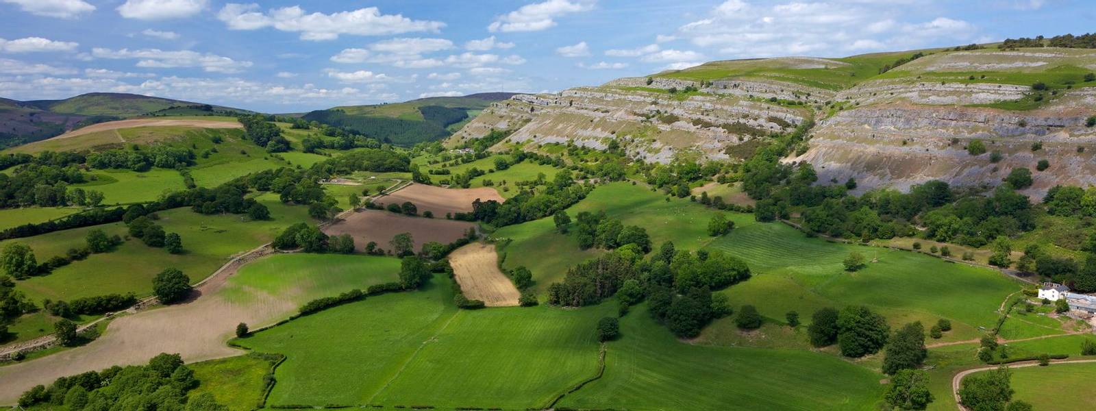View towards limestone escarpment of Creigiau Eglwyseg, from Castell Dinas Bran, Llangollen, Denbighshire, Wales, United Kin…