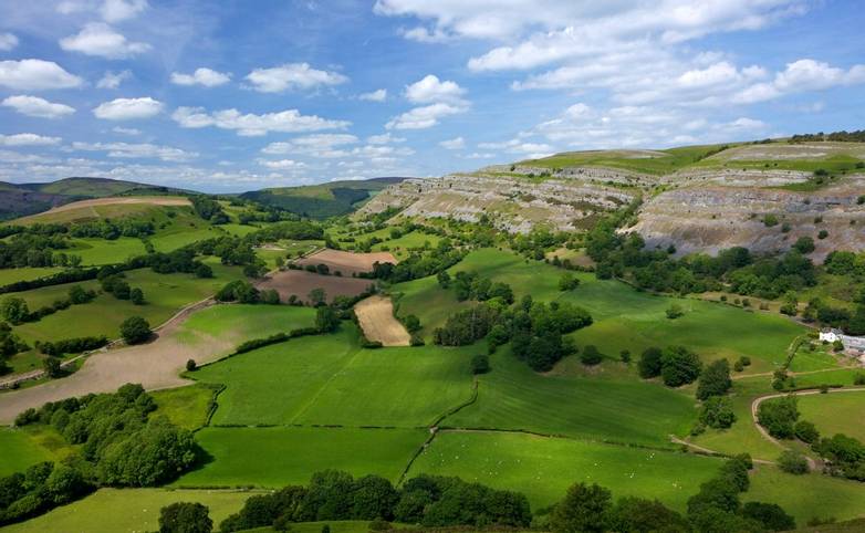 View towards limestone escarpment of Creigiau Eglwyseg, from Castell Dinas Bran, Llangollen, Denbighshire, Wales, United Kin…