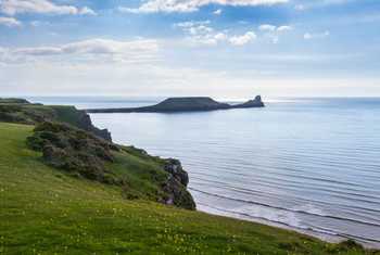 View across Rhossili Bay to the Worms Head Headland, Wales  shutterstock_198969338.jpg