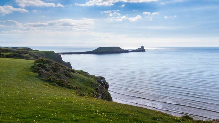 View across Rhossili Bay to the Worms Head Headland, Wales  shutterstock_198969338.jpg