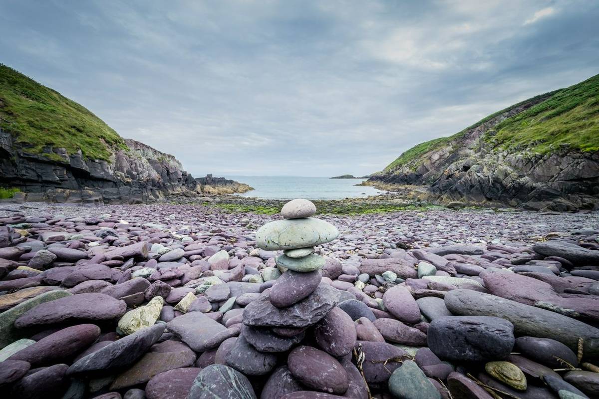 Pebbles stack on the beach on Caer Bwdy Bay in St.Davids, Wales