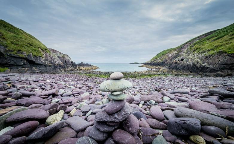 Pebbles stack on the beach on Caer Bwdy Bay in St.Davids, Wales