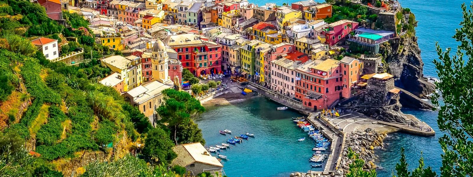 Scenic aerial view of ocean and harbor in colorful village Vernazza, Cinque Terre