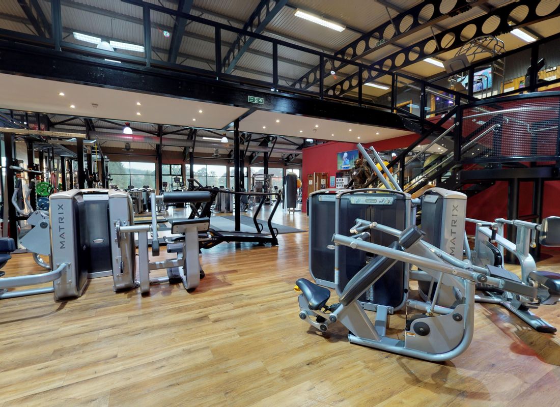 Resistance machines inside large hotel health club with amazing countryside view