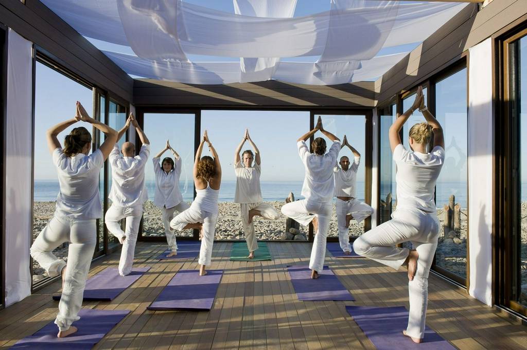 A yoga class on the beach at Paradis Plage 