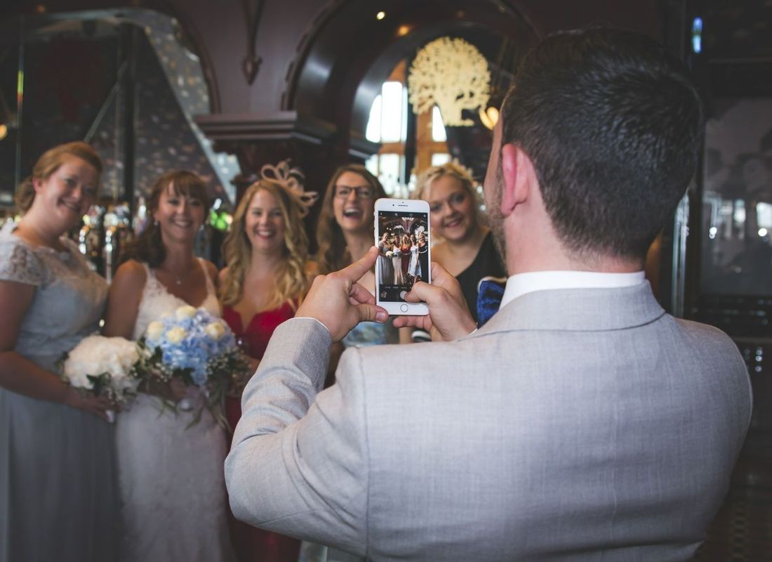 Man taking social media picture for hen party