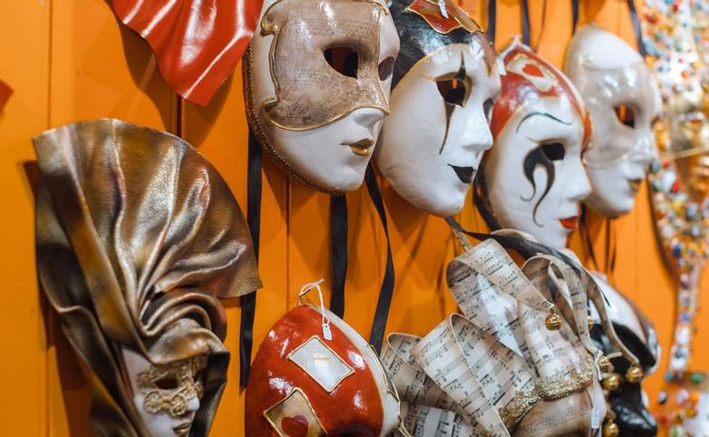 Venetian masks in store display in Venice.