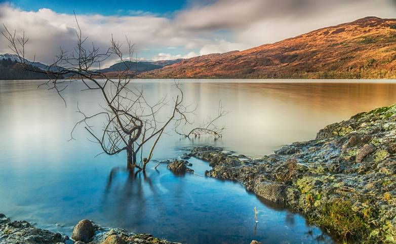A long exposure shot looking west from the southern shore of Loch Venachar, in the Trossachs, Scotland