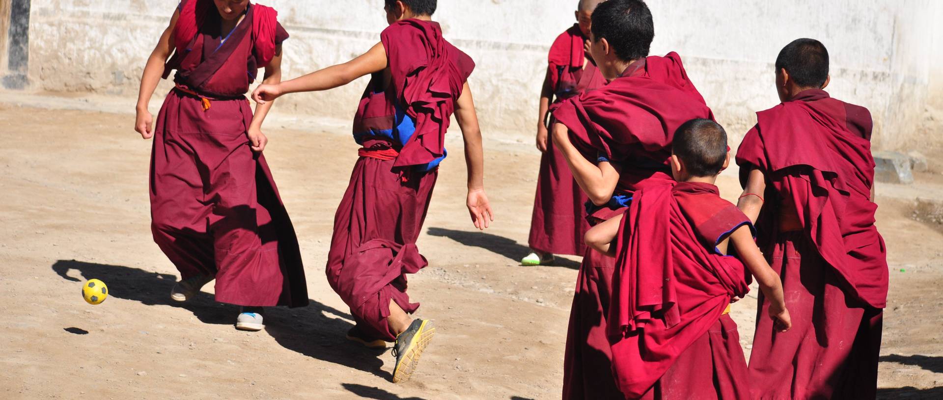 Monks Practicing Their Football Skills