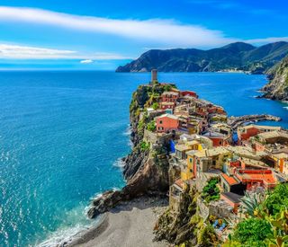 Scenic view of colorful village Vernazza and ocean coast in Cinque Terre, Italy