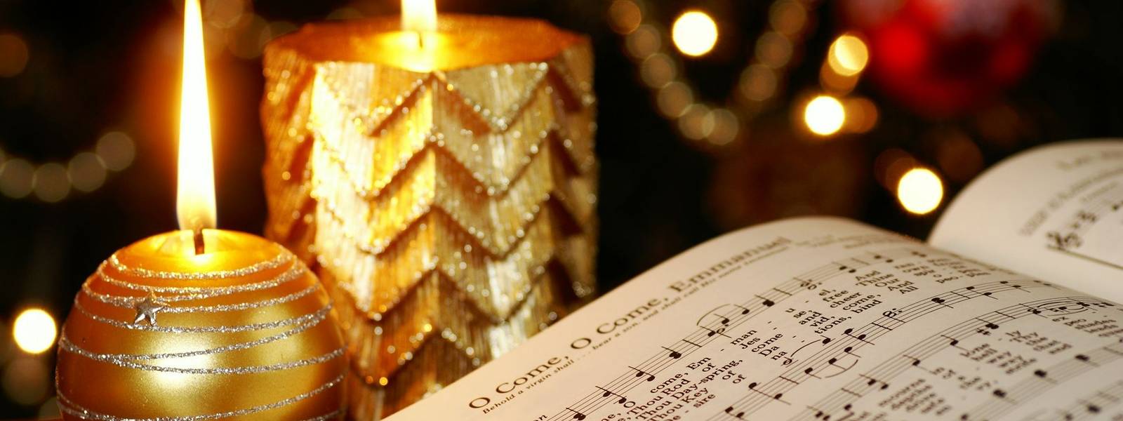 Detail of songbook with Christmas carols and Christmas decorations.