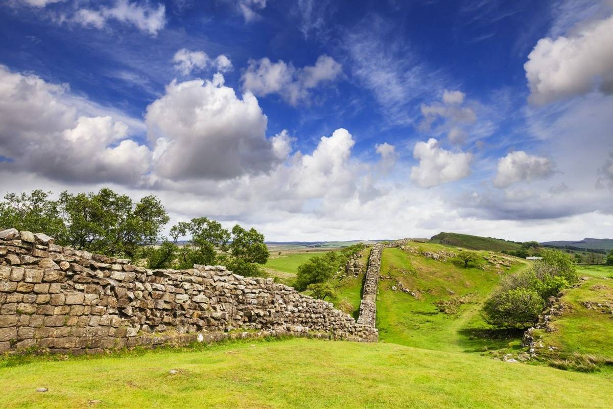 Hadrian's Wall under a dramatic sky at Walltown Crags, Northumberland, England.