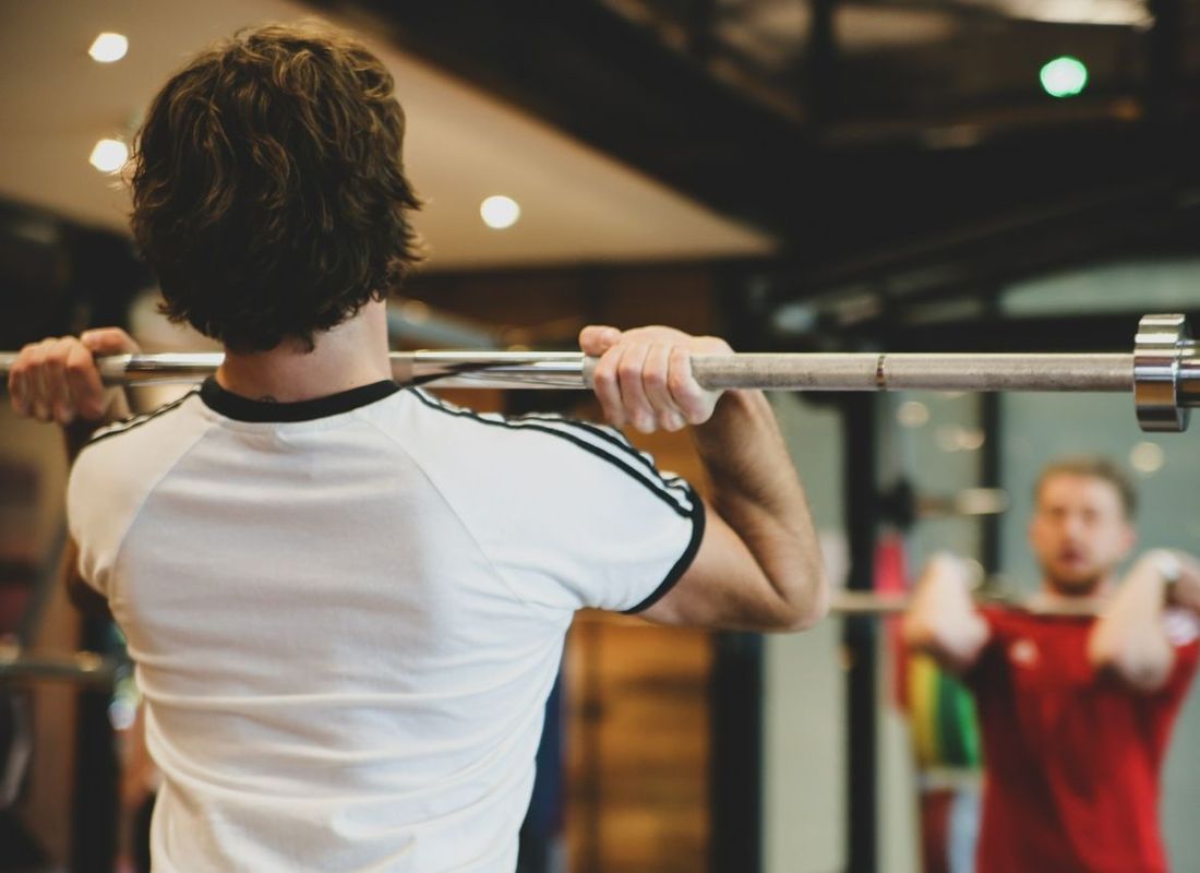 Personal trainer working with a client