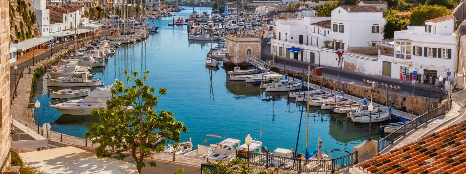 View on old town Ciutadella port on sunny day, Menorca island, Spain.