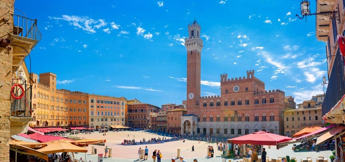 Italy, Siena. July 27, 2018 - Panorama of Piazza del Campo with Mangia Tover, Tuscany