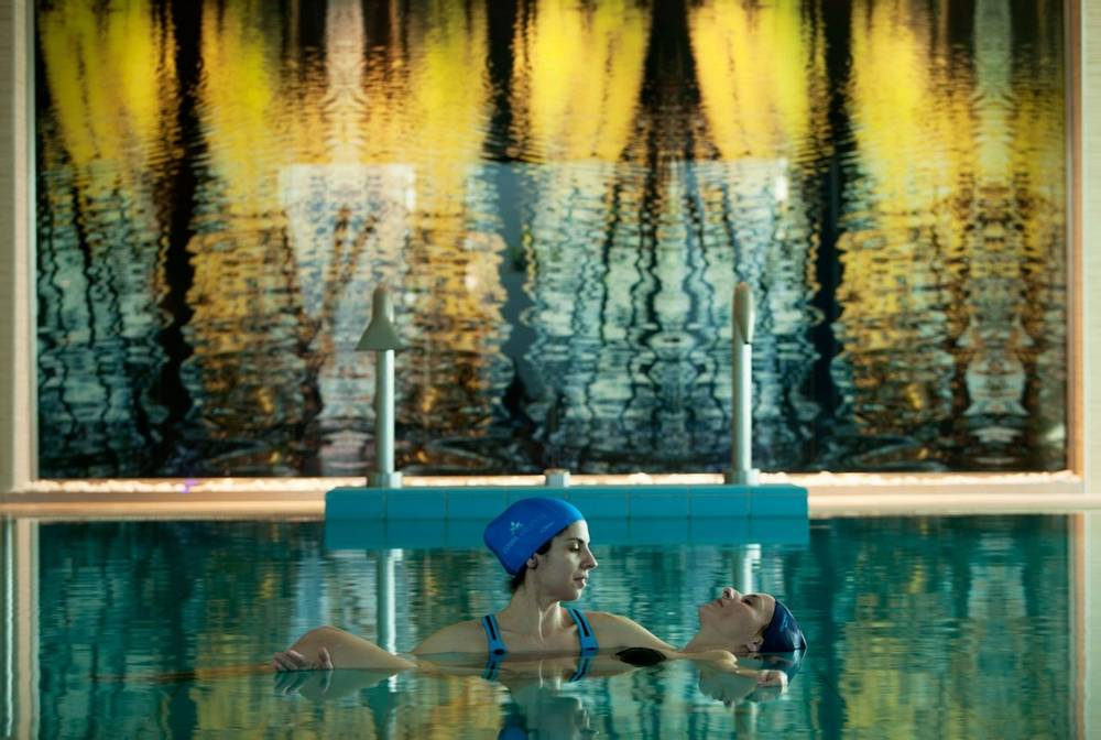 Watsu therapy in a swimming pool
