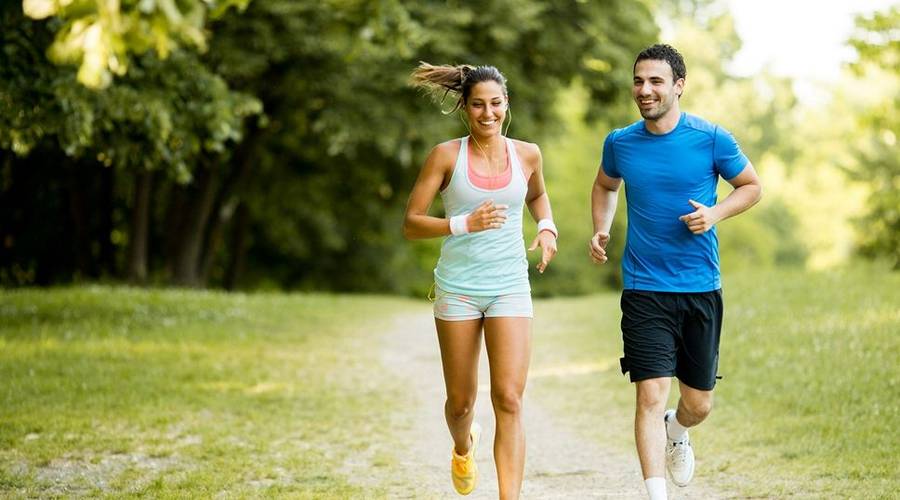 Couple running on a de-stress holiday in Portugal