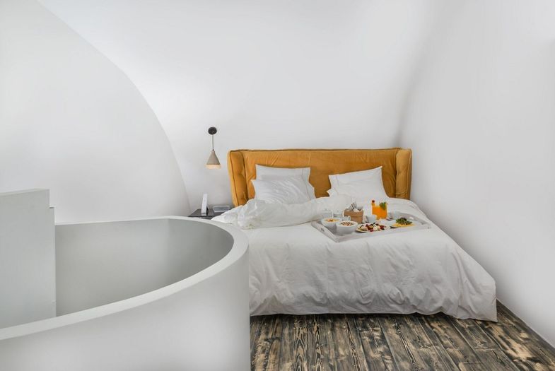 Andronis Concept Wellness Resort-accommodation double bed spiral staircase.jpg