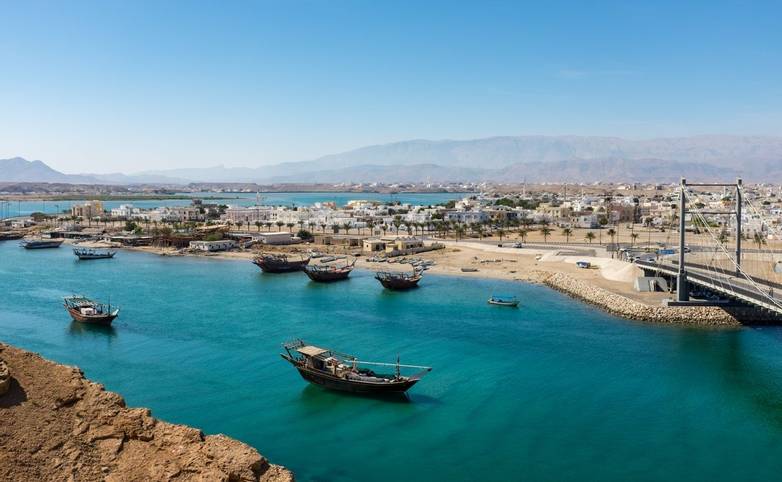 Traditional wooden dhow boats and the shipbuilding district in Sur, Oman