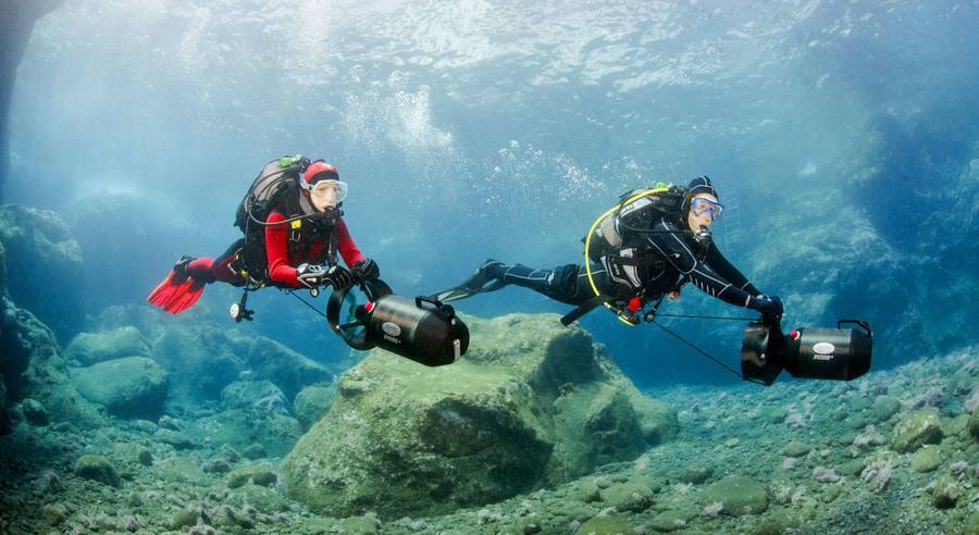 Man and woman diving in the ocean