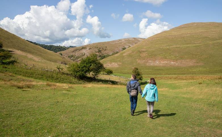 Friends exploring the beautiful countryside at Dovedale, Thorpe, Derbyshire, UK August 2018