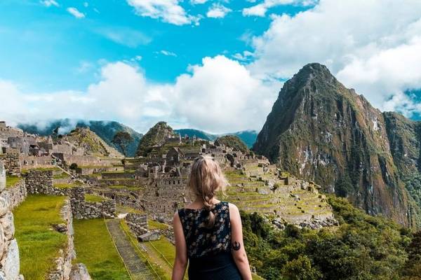 A woman walking towards Machu Picchu