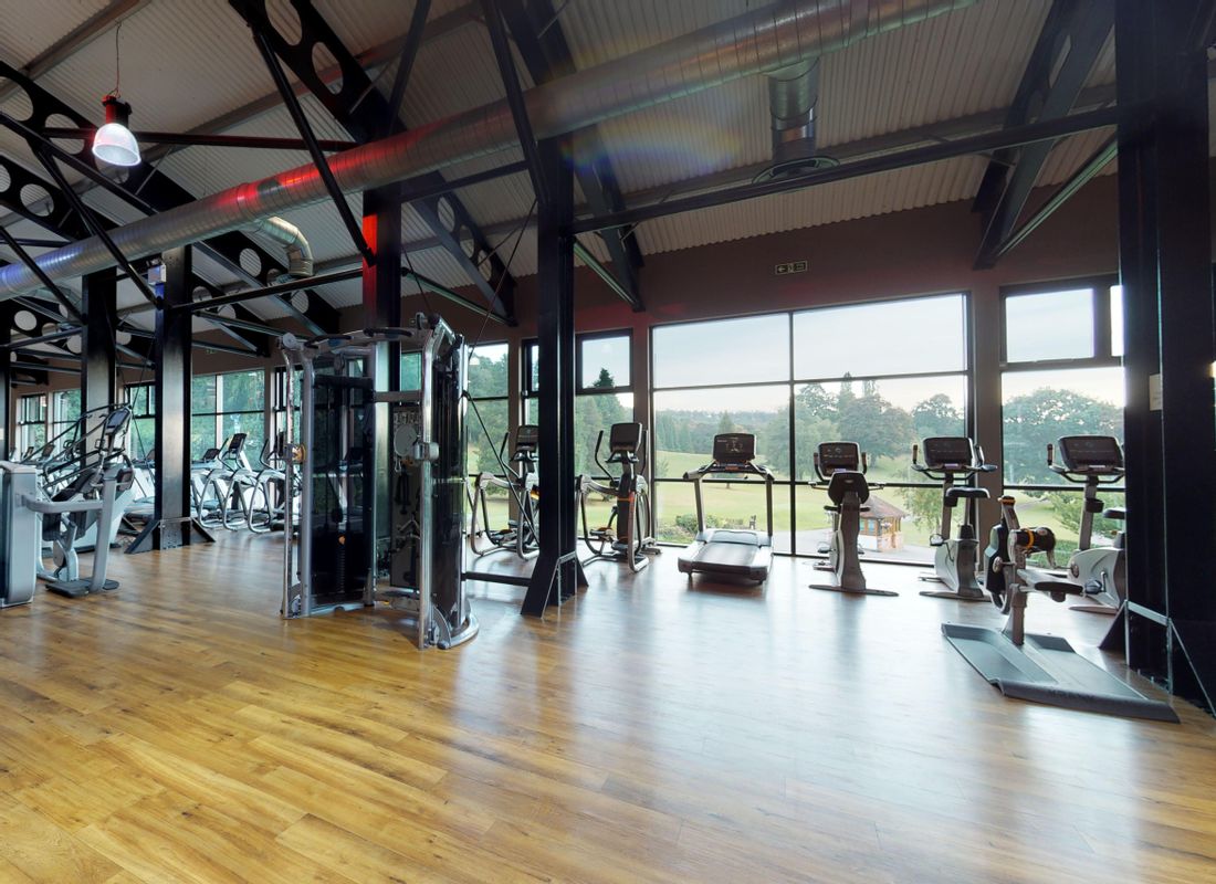 Large health club gym floor overlooking stunning Hampshire golf course