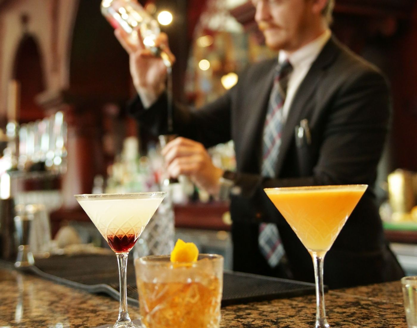 Cocktails being made in bar and lounge in Liphook