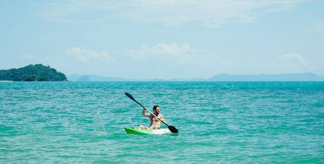 Man kayaking at Amatara Wellness Resort in Thailand