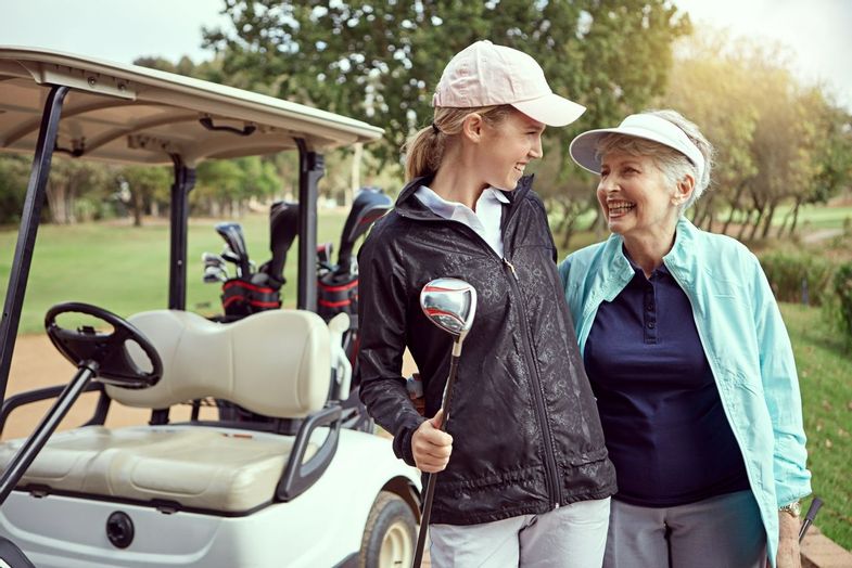 Cropped shot of a senior woman and her adult daughter on the golf course