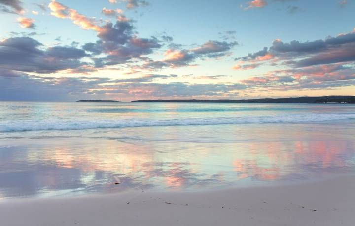 The pretty pastel colours of dawn sunrise and reflections in the water at Hyams Beach South Coast of NSW Austalia. A wonder… The pretty pastel colours of dawn sunrise and reflections in the water at Hyams Beach South Coast of NSW Austalia. A wonder…