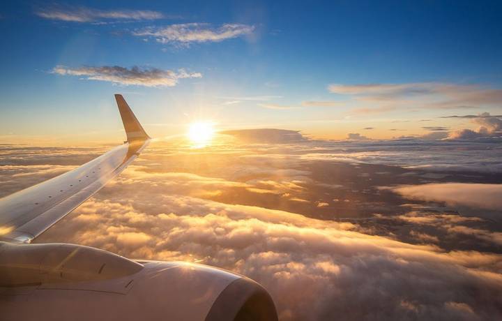 Sunset sky on airplane window over Copenhagen, Denmark, Scandinavia, Europe in Friday evening flight for relax in holiday Sunset sky on airplane window over Copenhagen, Denmark, Scandinavia, Europe in Friday evening flight for relax in holiday