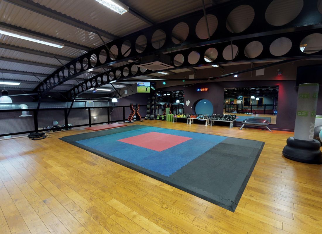 Mezzanine area inside Elevation health club being used for workout area