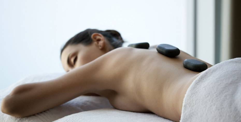 Woman having a stone massage on a wellness retreat