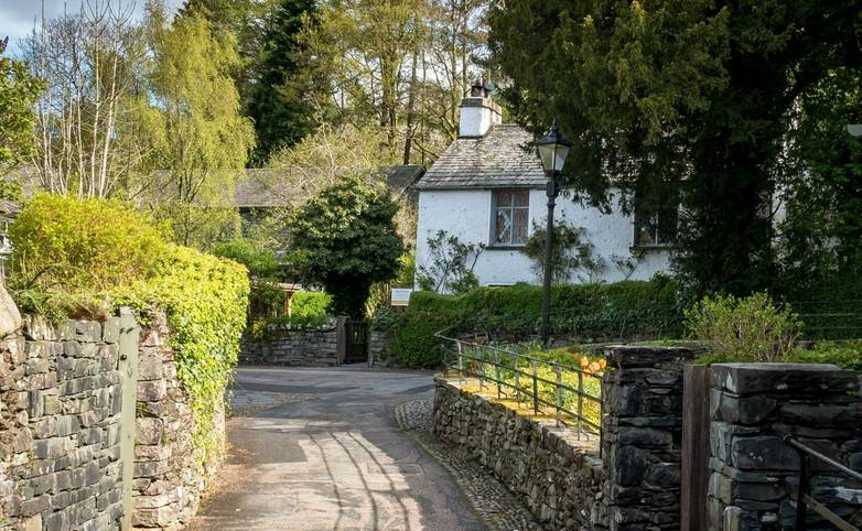 Traditional slate brick cottages in the rural English Lake District town of Grasmere known as the home of poet Willam Wordsw…